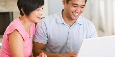 happy couple using computer