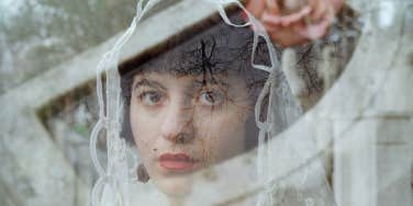 Woman staring out in wedding dress 