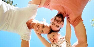 family of three huddled together