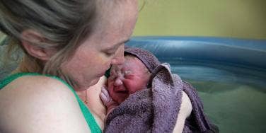 woman holding baby 