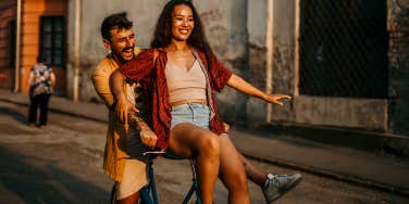 couple having fun riding bike together