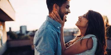 man and woman embracing and laughing together