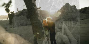 Couple carving a heart into a tree, romantic love 