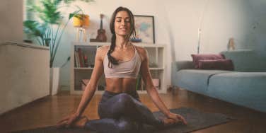 a lady doing yoga at home