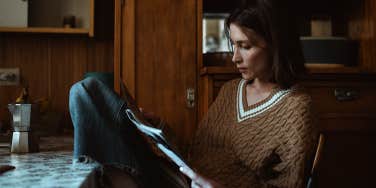 woman reading papers