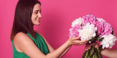 woman receiving flower