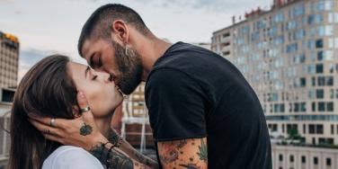 man kissing a woman passionately