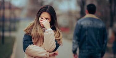 woman crying with man walking away