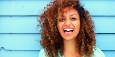 Portrait of a cheerful young woman smiling