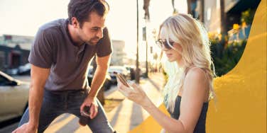 Woman asking random man for help with her phone