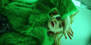 woman wearing green coat