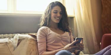 smiling woman texting