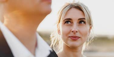 Portrait of a woman looking at a man in a sunset light