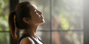 woman doing breathing exercise