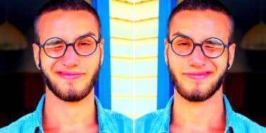 guy squinting into camera thinking about texting again after ghosting someone