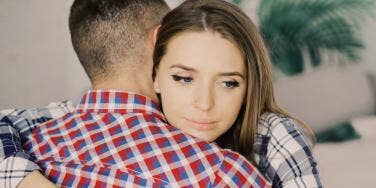 troubled woman hugging man