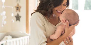 mother holding baby