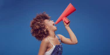 woman holding a speaker