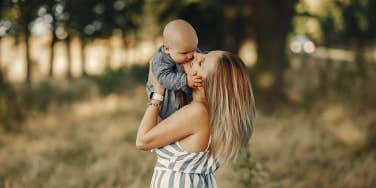 mother holding baby