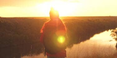 woman standing in sunset