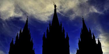Mormon LDS Salt Lake City Temple Silhouette against Blue Cloudy Sky