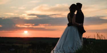 silhouette of bride and groom at sunset