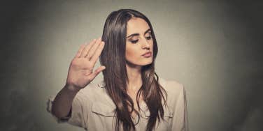 woman pushing her palm out