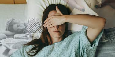 Girl in hospital cover her eyes