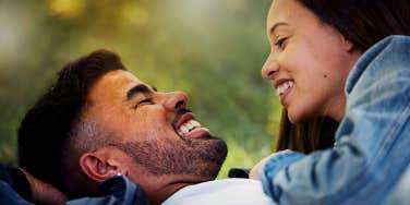 man and woman laughing together