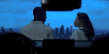 couple at night overlooking view