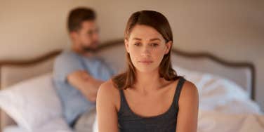 woman upset on bed
