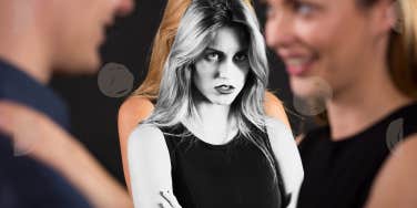 Woman staring at couple