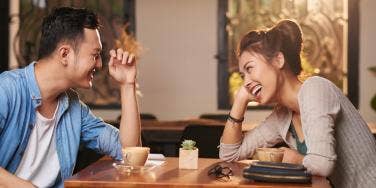 couple laughing at the table