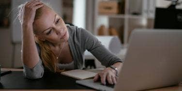 unhappy woman at computer