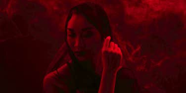 red woman looking away