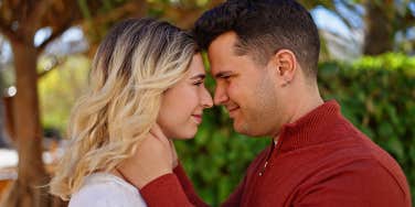 husband and wife embracing face to face