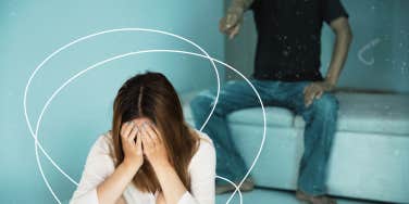 Woman with hands covering face