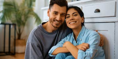 happy smiling couple in kitchen