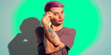 androgynous person with purple hair