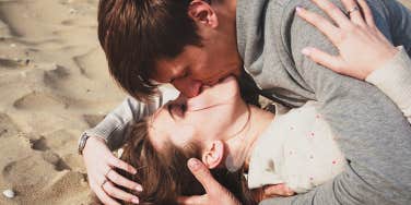 man and woman kissing