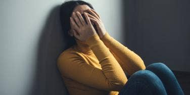 depressed woman head in hands