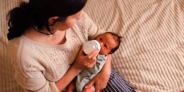 mother feeding newborn baby