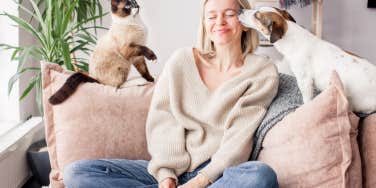 woman with a cat and dog