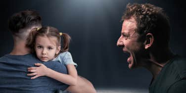 man holding girl, man yelling
