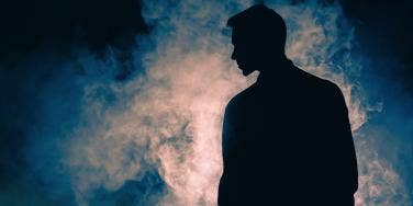 man looking over his shoulder