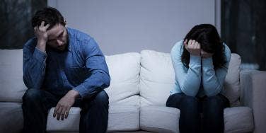 couple arguing on the couch