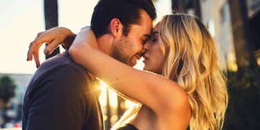 couple kissing outdoors