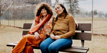 Author and Sue sitting on a park bench together