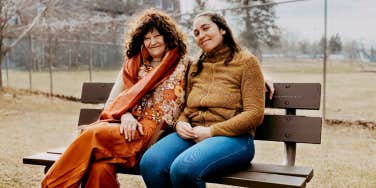 Author and Sue sitting on a park bench together
