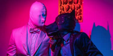two people in latex suits